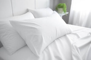 White bed with large pillows